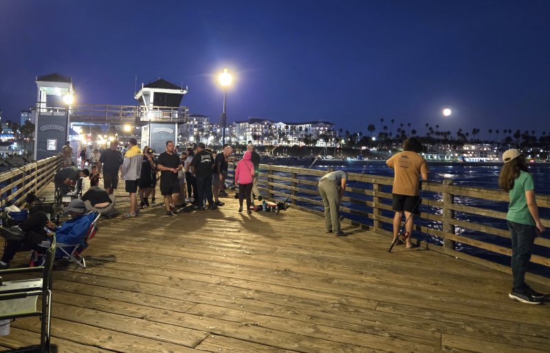 With a few of Oceanside’s large hotels and condominiums in the background, the pier is buzzing with activity well into the evening hours.